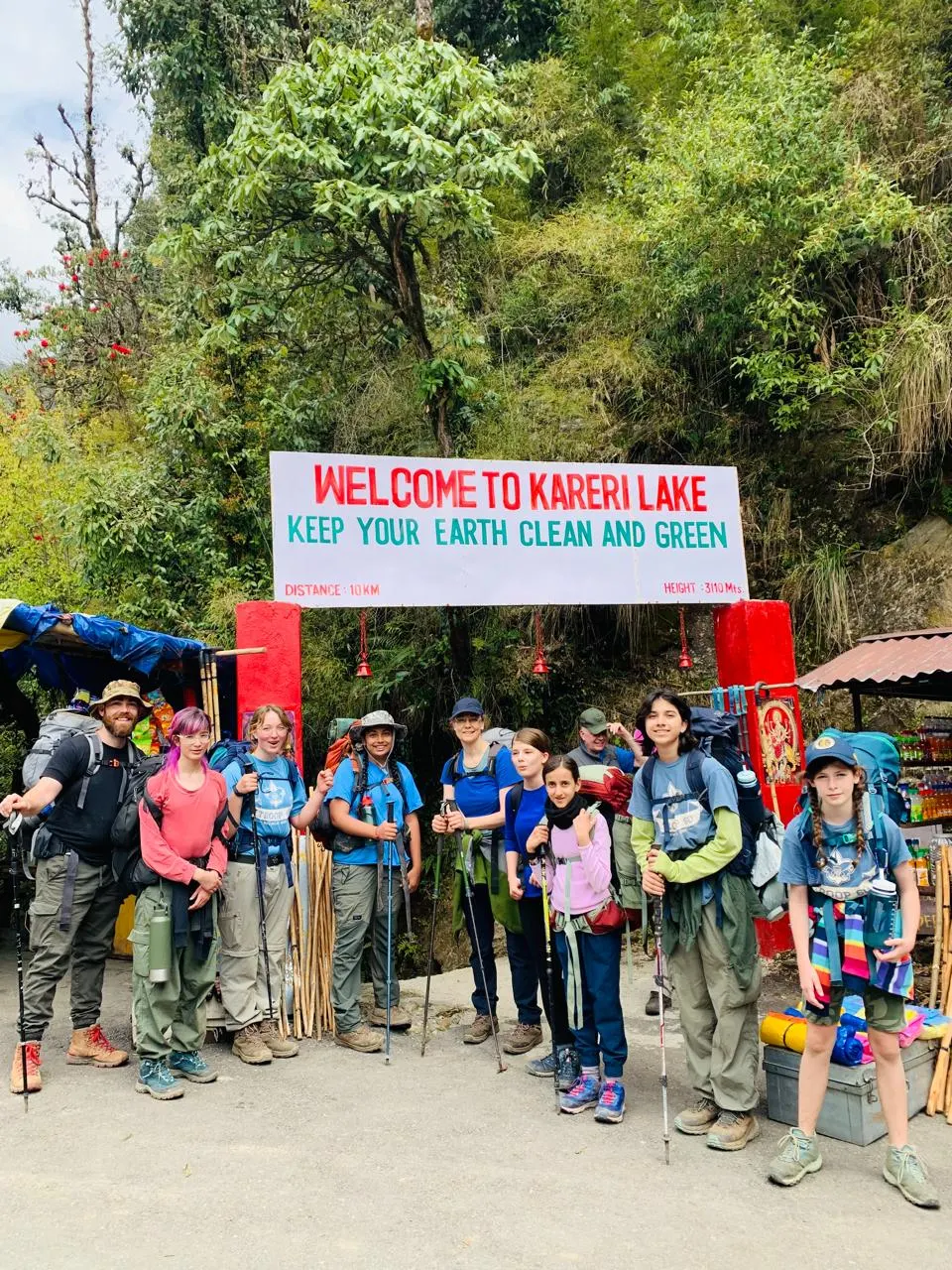 An international group with trekking poles